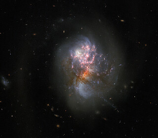 Exploring a Pair of Merging Galaxies (Hubble Image)