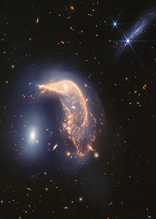 Interacting galaxies Arp 142 (NIRCam and MIRI image)